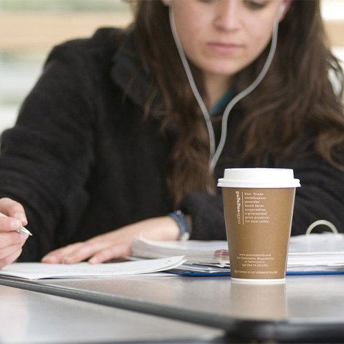 student studying while drinking coffee